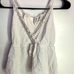 White cute summer shirt has 2 holes and one little non noticeable stain